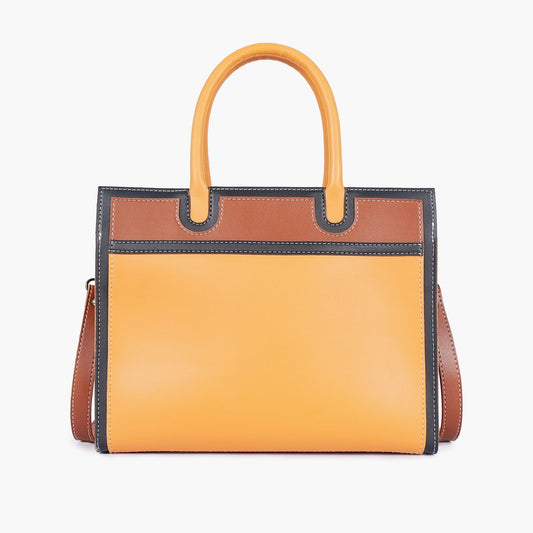 Mustard color-block structured tote bag angled view with shoulder strap